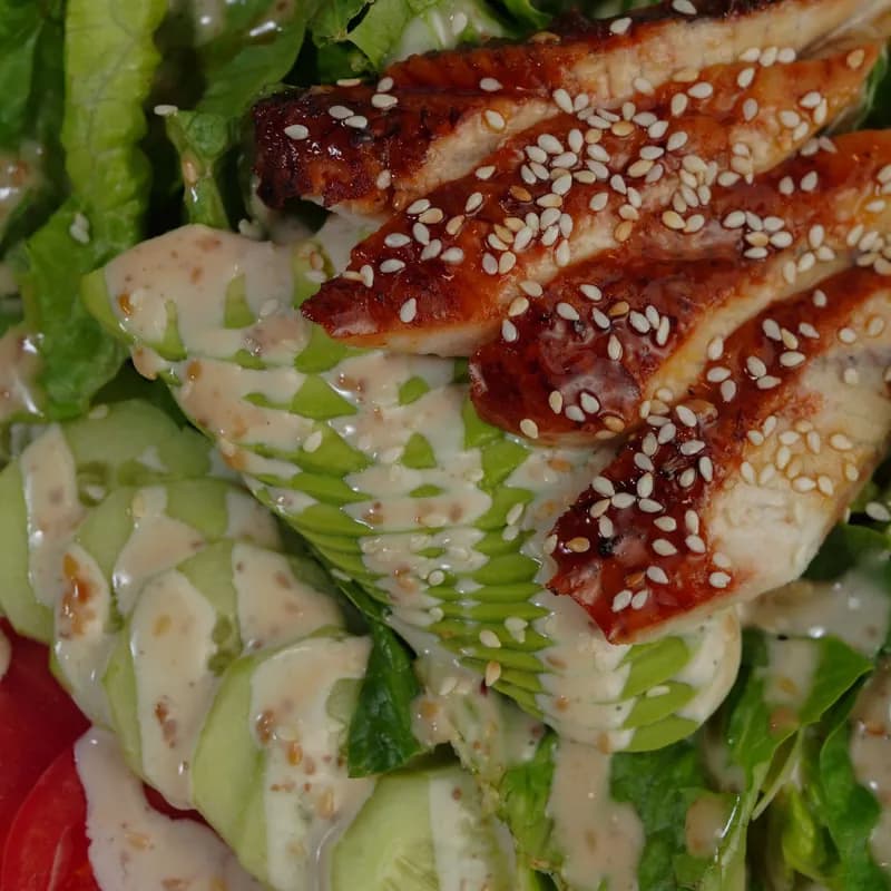 Grilled chicken avocado salad with sesame dressing, a Southwest avocado style salad idea