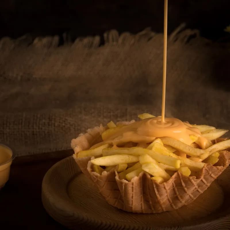 Sauce poured over fries in a bowl, like the gravy on Wendy's poutine that contains wheat