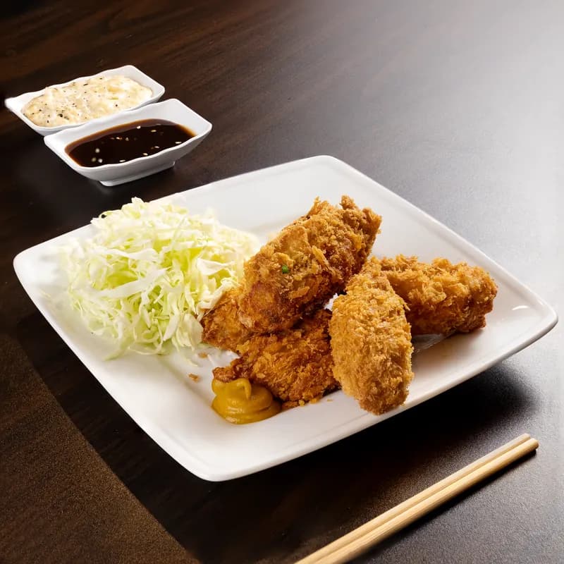 Breaded fried chicken with cabbage and dipping sauces, a reminder to check sauces for hidden gluten