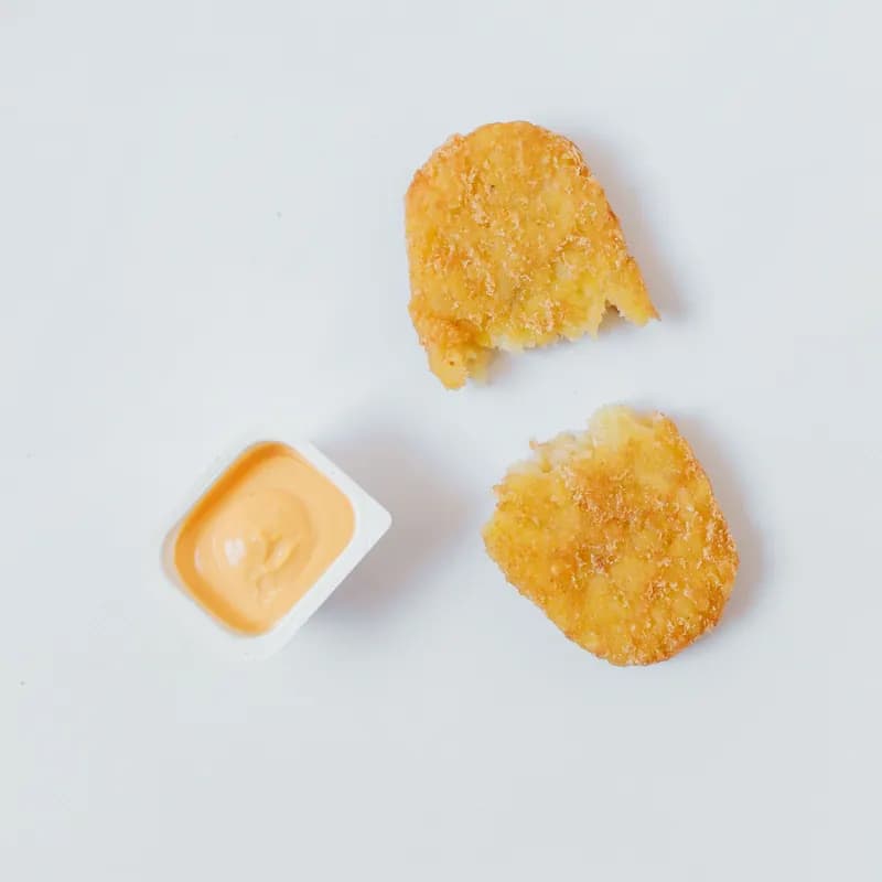 Hash browns with dipping sauce, a breakfast potato side similar to Wendy's gluten free breakfast potatoes