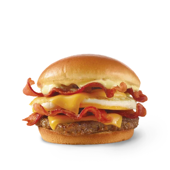 Wendy’s Breakfast Baconator® sandwich with grilled sausage, bacon, egg, two slices of cheese, and Swiss cheese sauce on a toasted bun.