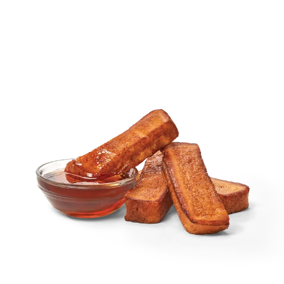 Wendy’s 4 PC. Homestyle French Toast Sticks served golden brown with a side of syrup for dipping.