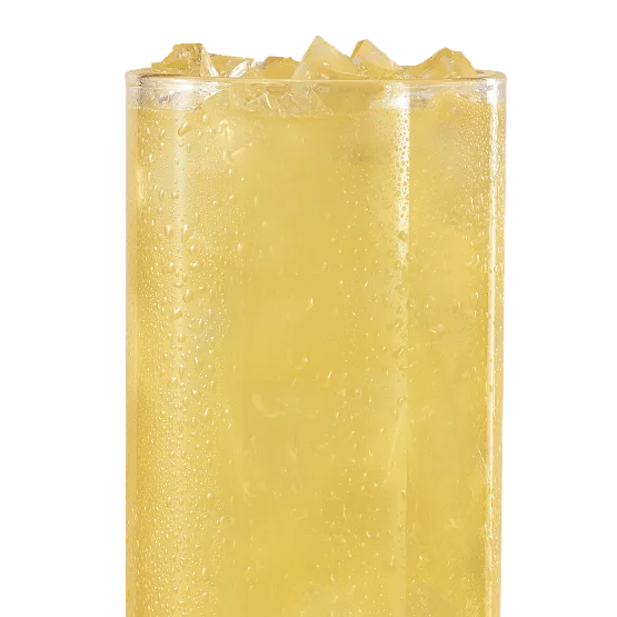 Wendy’s Pineapple Mango Lemonade with tropical golden color, served over ice in a clear cup.