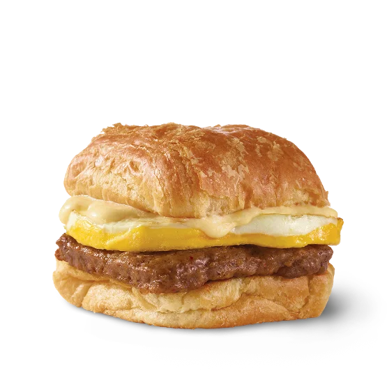 Wendy’s Sausage, Egg & Swiss Croissant with grilled sausage, a fresh egg, and creamy Swiss cheese sauce on a flaky croissant.