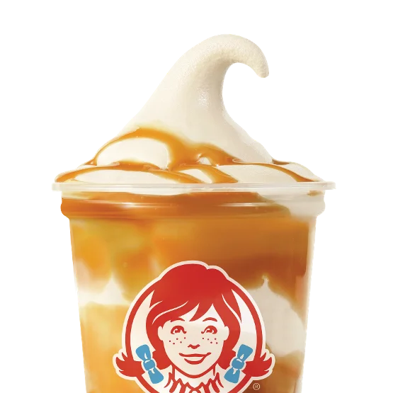 Wendy’s Caramel Vanilla Frosty Swirl™ with golden caramel ribbons blended into vanilla Frosty in a dessert cup.