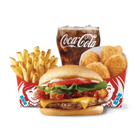 Wendy’s Jr. Bacon Cheeseburger Biggie Bag® with burger, nuggets, fries, and a soft drink on a tray.