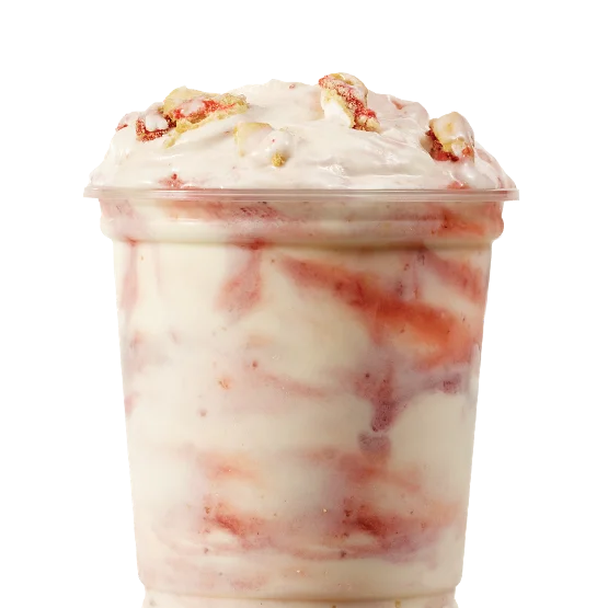 Wendy’s Pop-Tarts® Strawberry Vanilla Frosty Fusion™ with Frosty, Pop-Tarts® pieces, and strawberry drizzle in a dessert cup.