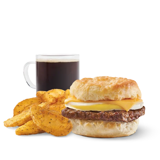 Wendy’s Sausage, Egg & Cheese Biscuit Combo with savory sausage, fluffy egg, and melted cheese on a buttermilk biscuit, served with breakfast potatoes and a drink.