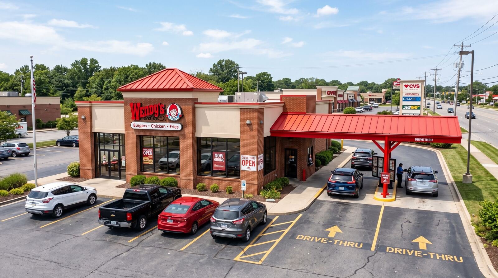 how many wendys locations – wendy's restaurant exterior with drive-thru during the day
